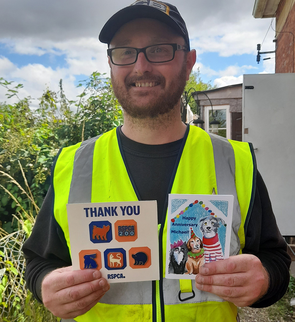 Volunteer Michael with his thank you card from the team 