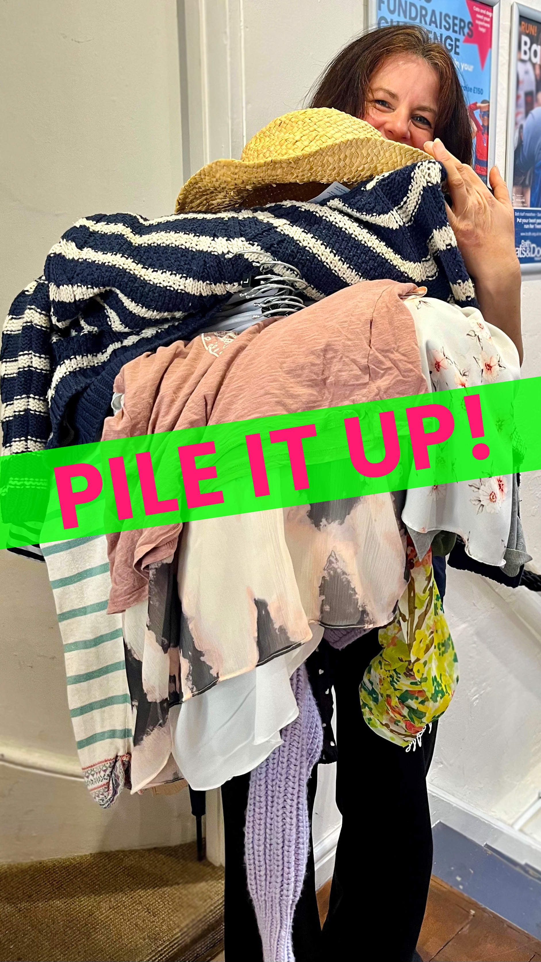 Woman carrying a big pile of clothes during a sale, with a flash saying Pile it up! 